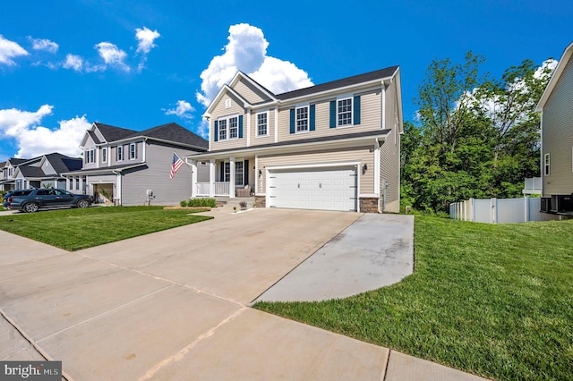 view of front of home featuring fence, a front lawn, concrete driveway, a garage, and stone siding