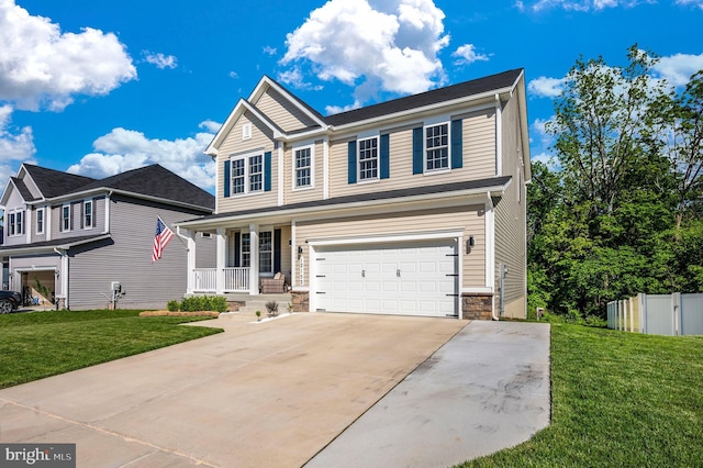 view of front of property with an attached garage, concrete driveway, a front lawn, and fence