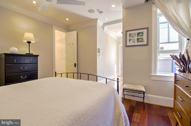 bedroom featuring recessed lighting, baseboards, wood-type flooring, and crown molding