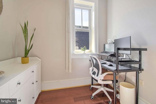 home office featuring baseboards and wood finished floors