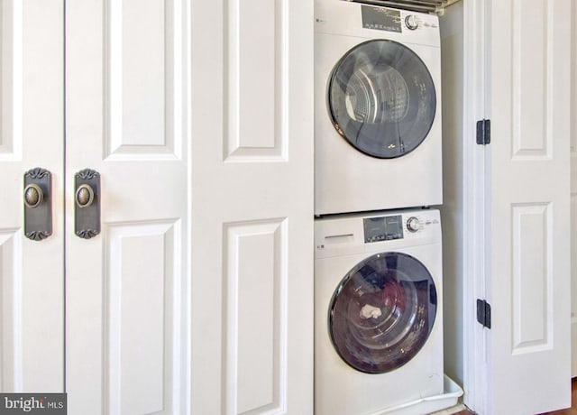 laundry area featuring laundry area and stacked washer and dryer