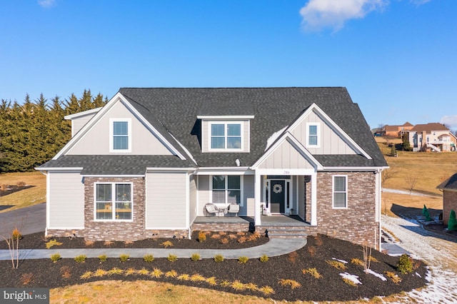 286 Claremont Ave, Harrisonburg, VA 22801 - view of front of house featuring board and batten siding, brick siding, covered porch, and roof with shingles