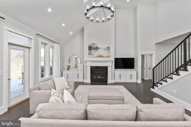 286 Claremont Ave, Harrisonburg, VA 22801 - living area featuring dark wood finished floors, stairway, a fireplace with flush hearth, and high vaulted ceiling