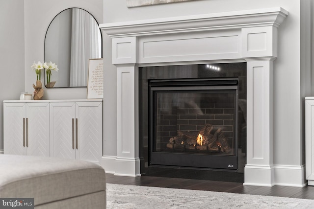 286 Claremont Ave, Harrisonburg, VA 22801 - details with baseboards, a lit fireplace, and wood finished floors