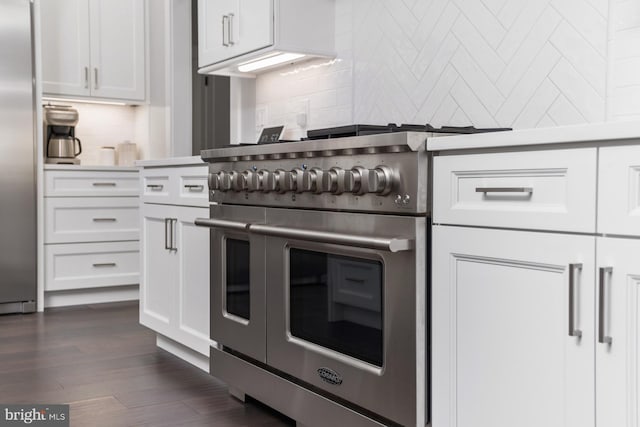 286 Claremont Ave, Harrisonburg, VA 22801 - kitchen with dark wood-style floors, backsplash, appliances with stainless steel finishes, and white cabinets