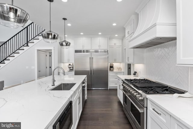 286 Claremont Ave, Harrisonburg, VA 22801 - kitchen featuring white cabinetry, premium appliances, premium range hood, and a sink