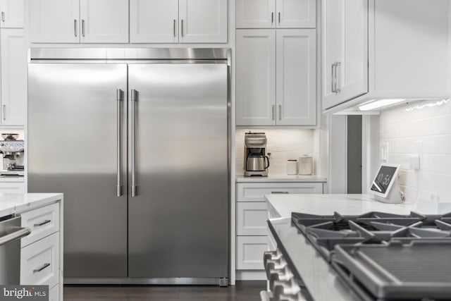 286 Claremont Ave, Harrisonburg, VA 22801 - kitchen featuring light stone counters, backsplash, appliances with stainless steel finishes, and white cabinetry