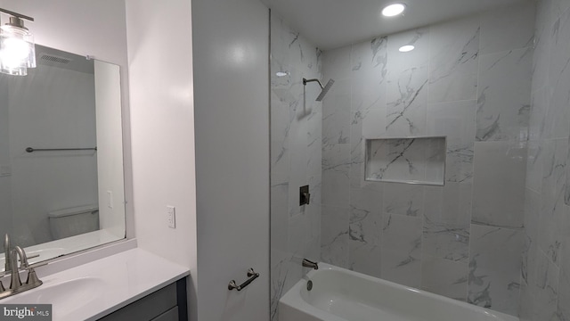 full bath with bathtub / shower combination, toilet, and vanity