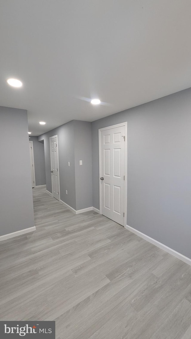 finished basement with light wood finished floors and baseboards