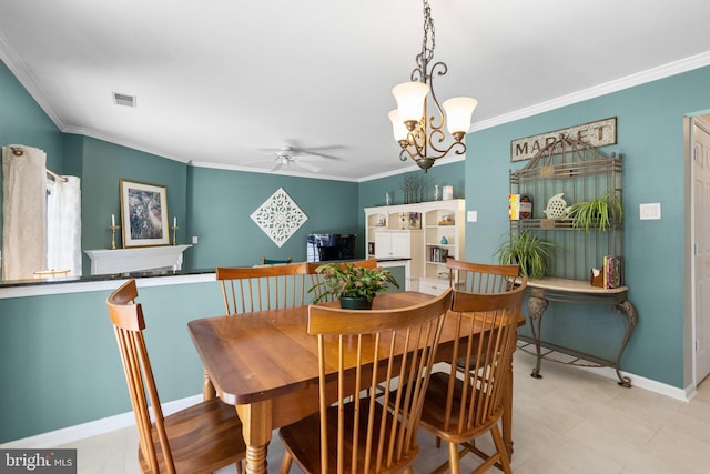 dining area featuring baseboards, ceiling fan with notable chandelier, visible vents, and ornamental molding