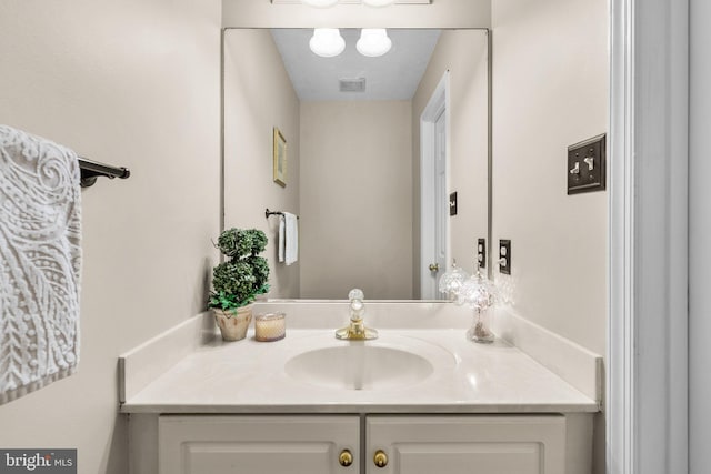 bathroom featuring visible vents and vanity