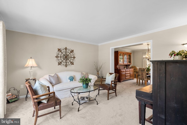 living room with a notable chandelier, baseboards, light colored carpet, and crown molding