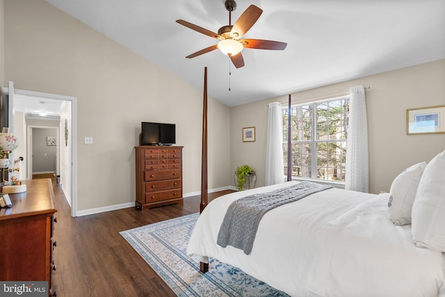 bedroom featuring dark wood-style flooring, a ceiling fan, baseboards, and vaulted ceiling