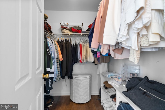 spacious closet with wood finished floors