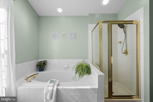 full bath with a bath, recessed lighting, and a stall shower