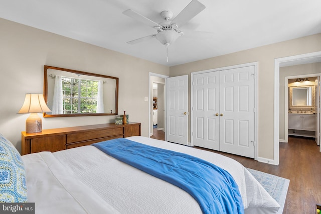 bedroom with a closet, baseboards, wood finished floors, and a ceiling fan