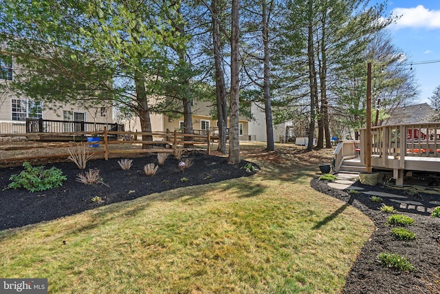 view of yard featuring a wooden deck