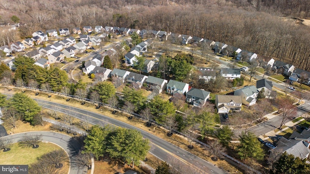 birds eye view of property with a residential view