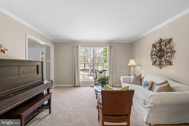 living area featuring baseboards, carpet, and ornamental molding