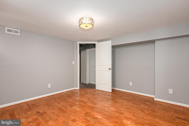 unfurnished bedroom with baseboards, visible vents, a closet, and light wood-type flooring