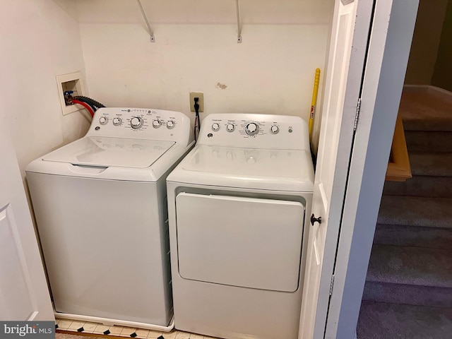 washroom with laundry area and washing machine and dryer