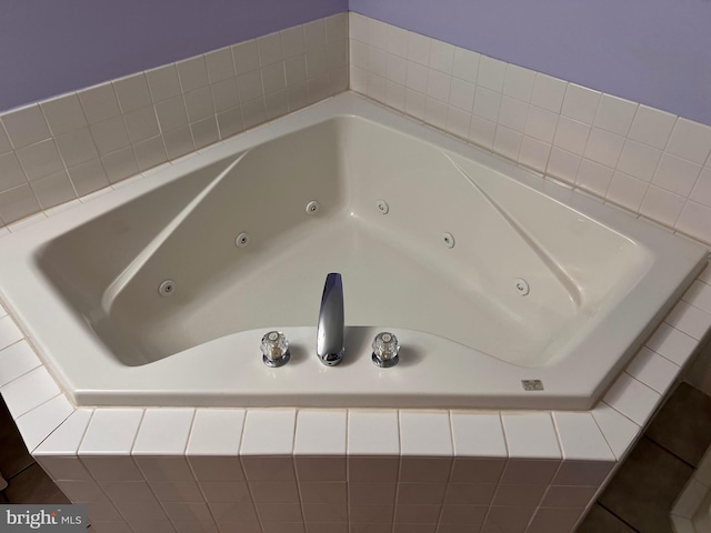 full bath featuring a tub with jets