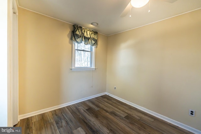 unfurnished room with dark wood-type flooring, baseboards, and ceiling fan