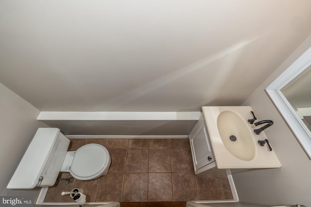 bathroom featuring toilet and a sink