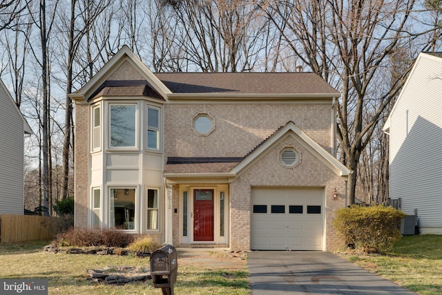 traditional-style house with central air condition unit, brick siding, and roof with shingles