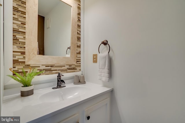 bathroom featuring decorative backsplash and vanity