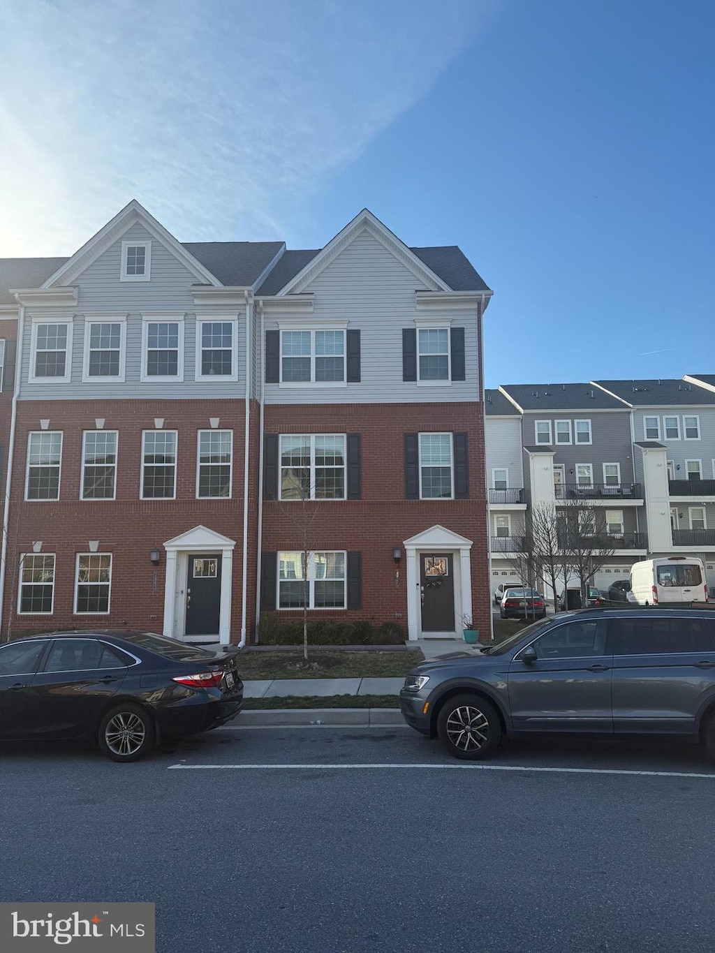 view of property with brick siding