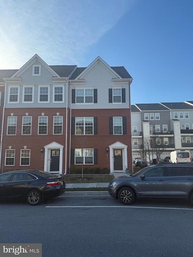 view of property with brick siding