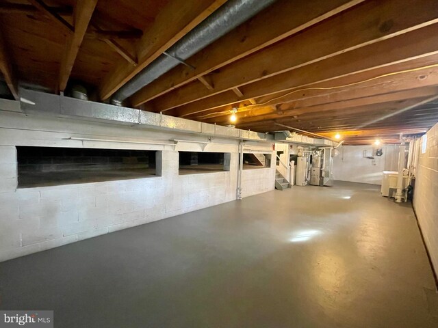 unfinished basement with water heater