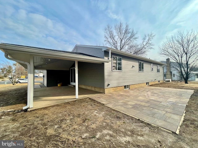 rear view of house with a patio