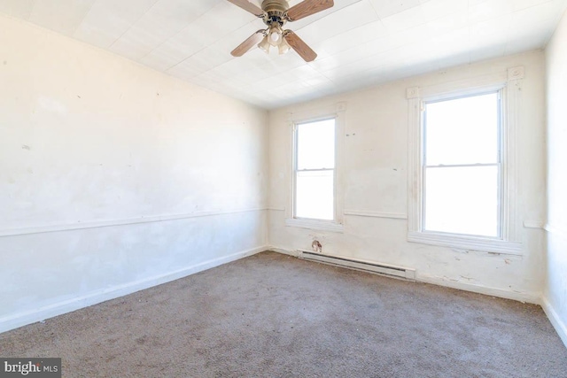 empty room featuring a baseboard radiator, carpet floors, baseboards, and a ceiling fan