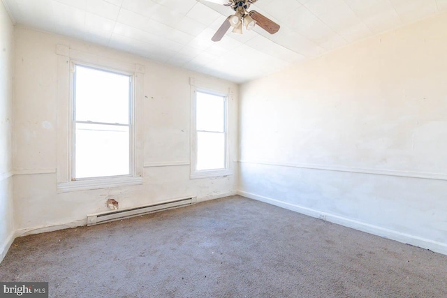 spare room featuring a baseboard radiator, carpet floors, baseboards, and ceiling fan