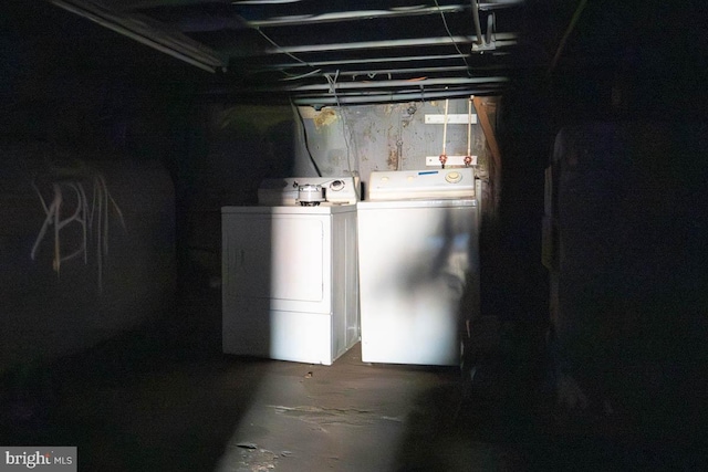 unfinished basement featuring washer and clothes dryer