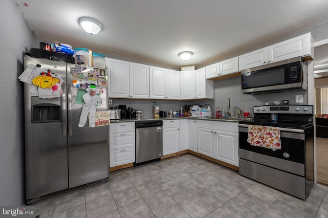 123 S 9th St, Millville, NJ 08332 - kitchen with white cabinetry, stainless steel appliances, and a sink