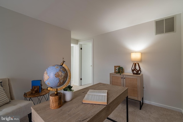 office space with visible vents, baseboards, and carpet floors