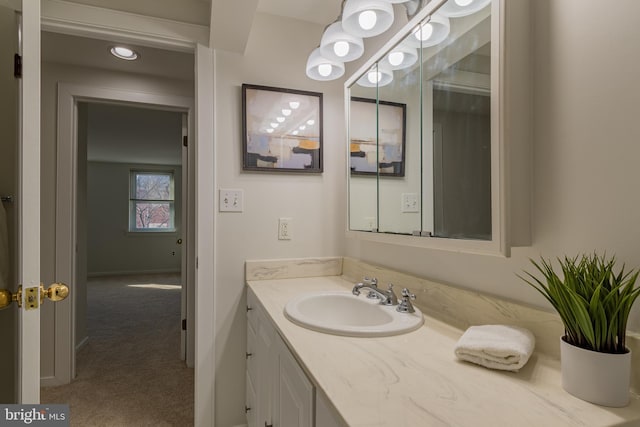 bathroom with vanity and baseboards