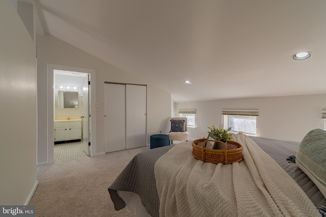 bedroom with baseboards, carpet floors, recessed lighting, vaulted ceiling, and connected bathroom