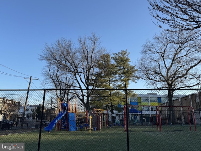 communal playground featuring fence