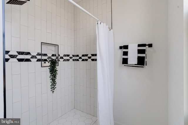 full bath with a tile shower