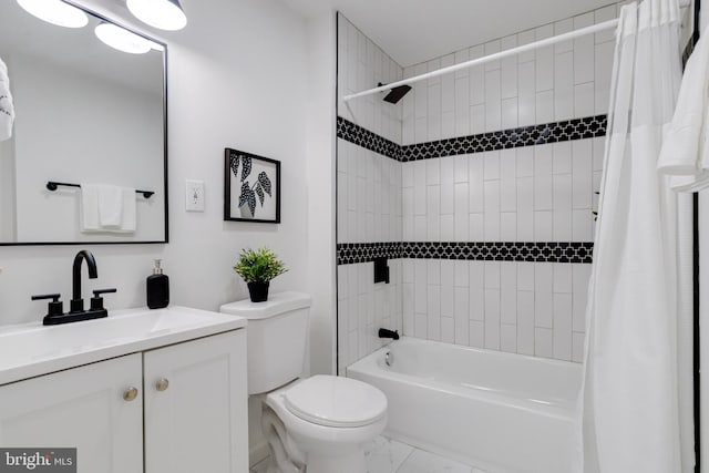 full bathroom with toilet, marble finish floor, shower / bath combo, and vanity