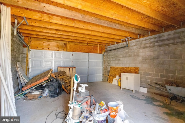 garage with concrete block wall