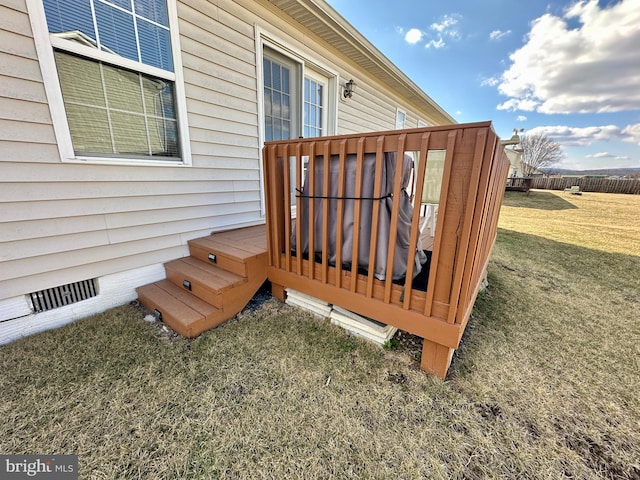 wooden deck with a lawn