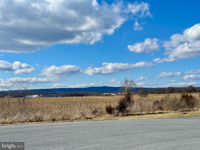 view of mountain feature with a rural view