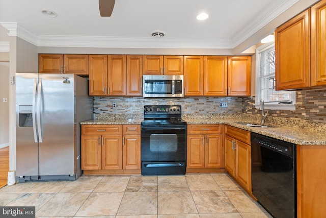 kitchen with visible vents, brown cabinets, black appliances, a sink, and light stone counters