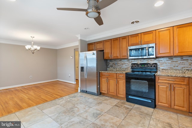 kitchen featuring stainless steel appliances, brown cabinets, visible vents, and ornamental molding