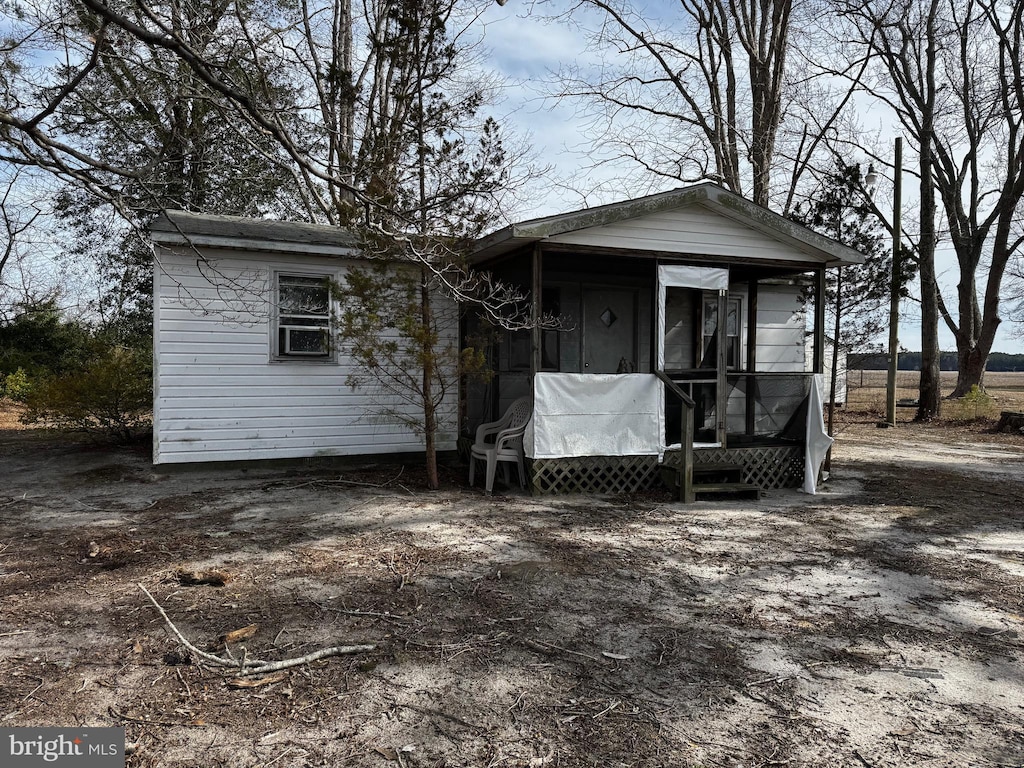 view of front of property featuring a sunroom